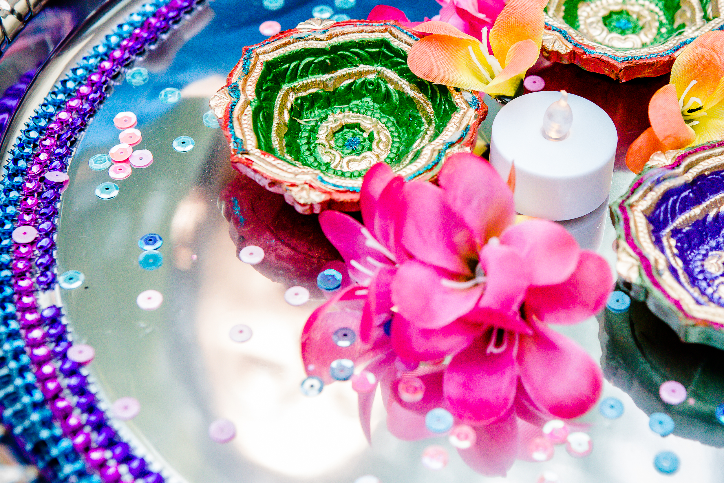 Colorful traditional wedding tray with flowers, candles, and decorative handcrafted items